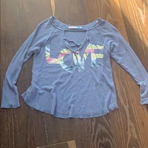 Blue shirt with really soft material Has word love